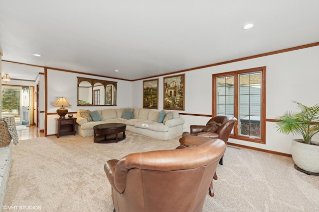 living room featuring light carpet, a wealth of natural light, and ornamental molding