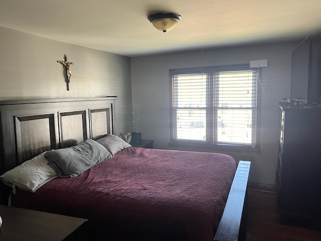 bedroom featuring dark wood-type flooring