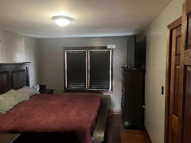 bedroom featuring dark hardwood / wood-style flooring