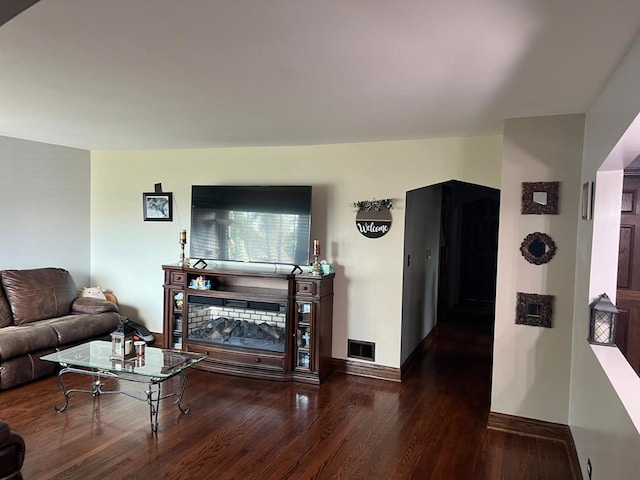 living room with dark wood-type flooring