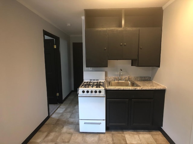 401 Robinson St, Danville, IL 61832 - kitchen with sink and white gas range oven