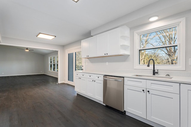 kitchen with sink, dishwasher, ceiling fan, dark hardwood / wood-style floors, and white cabinets