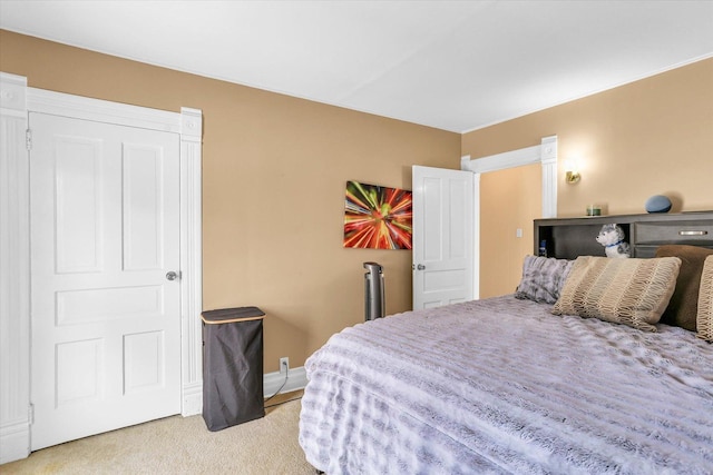 bedroom featuring light colored carpet