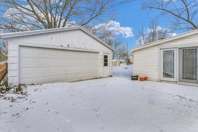 view of snow covered garage