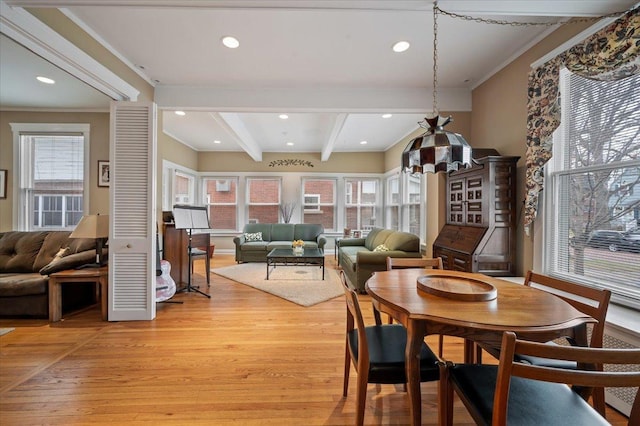 dining space featuring recessed lighting, beam ceiling, light wood-style floors, and crown molding