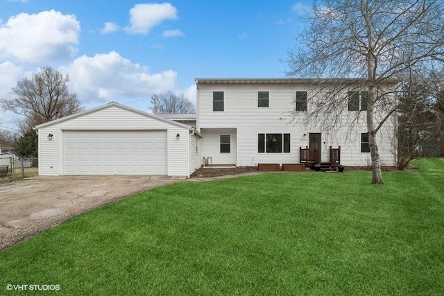 view of front of house with a garage and a front lawn