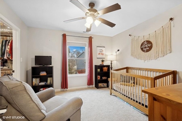 bedroom with light colored carpet and ceiling fan