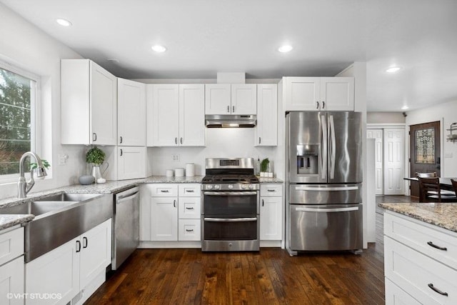 kitchen featuring sink, stainless steel appliances, and white cabinets