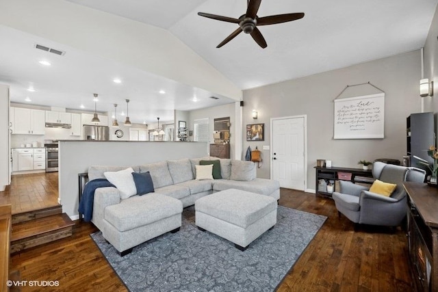 living room featuring vaulted ceiling, ceiling fan, and dark hardwood / wood-style flooring