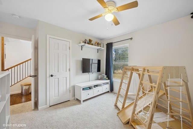 bedroom with light carpet and ceiling fan