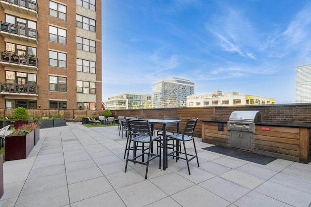 view of patio featuring exterior kitchen and grilling area