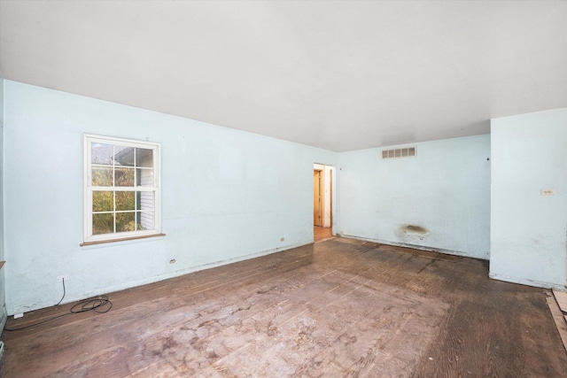 unfurnished room with hardwood / wood-style flooring