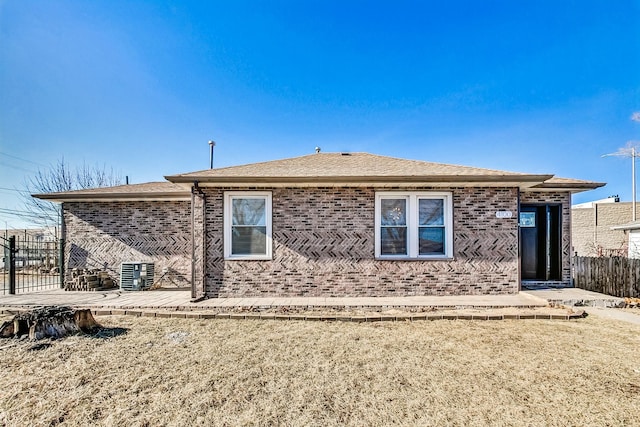 back of property featuring a patio area and a lawn