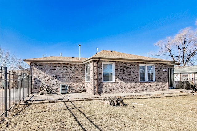 rear view of property featuring a yard and a patio area