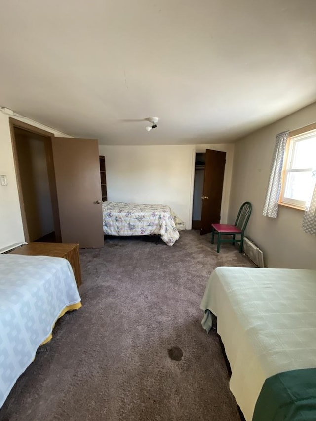 bedroom featuring dark carpet