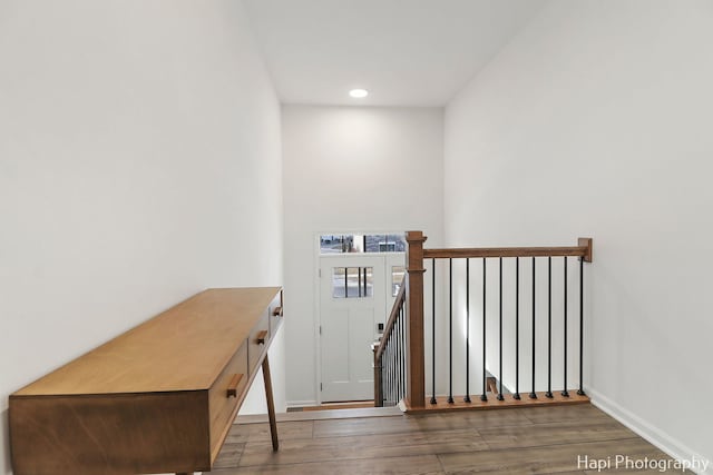 stairway featuring hardwood / wood-style flooring