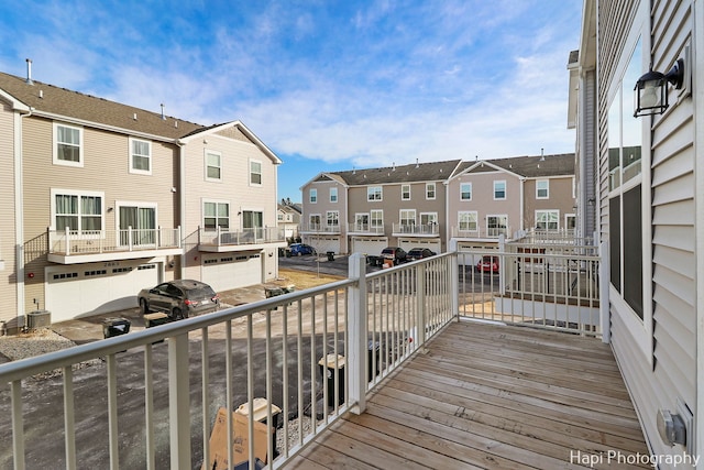 wooden deck featuring grilling area and central AC