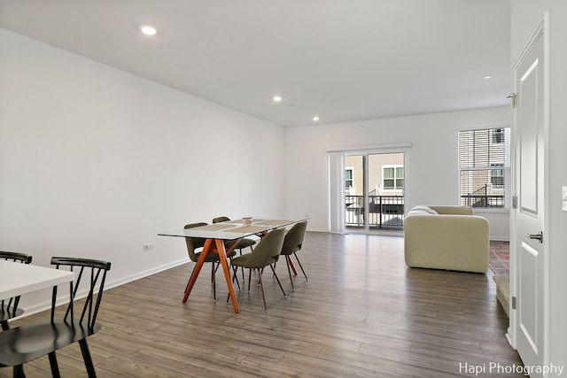 dining area with dark hardwood / wood-style flooring