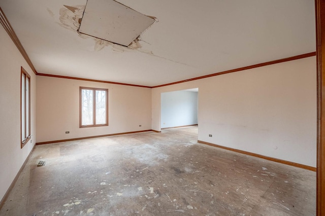 unfurnished room featuring crown molding