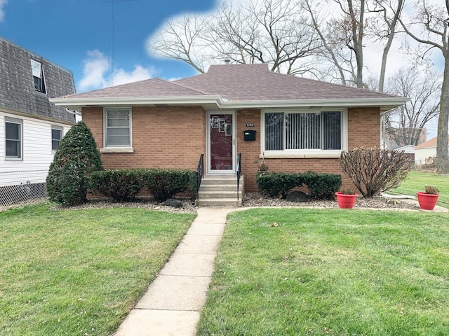 view of front of home with a front lawn