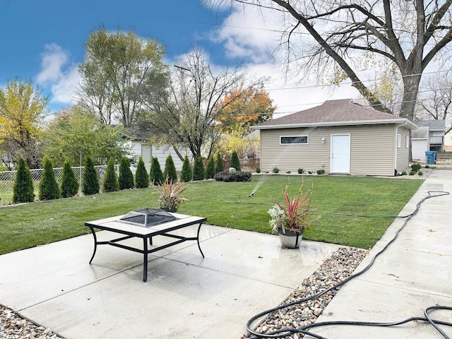 view of patio / terrace featuring a fire pit and an outdoor structure