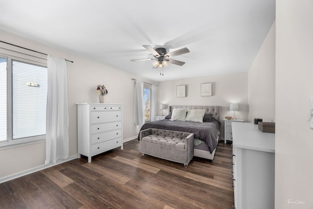 bedroom with dark hardwood / wood-style flooring and ceiling fan