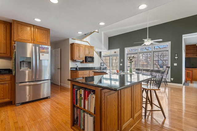 1404 Waterford Pl, Champaign, IL 61821 - kitchen featuring stainless steel refrigerator with ice dispenser, ceiling fan, light wood finished floors, black microwave, and recessed lighting