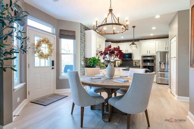 dining area with light hardwood / wood-style flooring