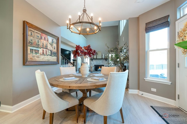 dining room featuring light hardwood / wood-style floors and a notable chandelier