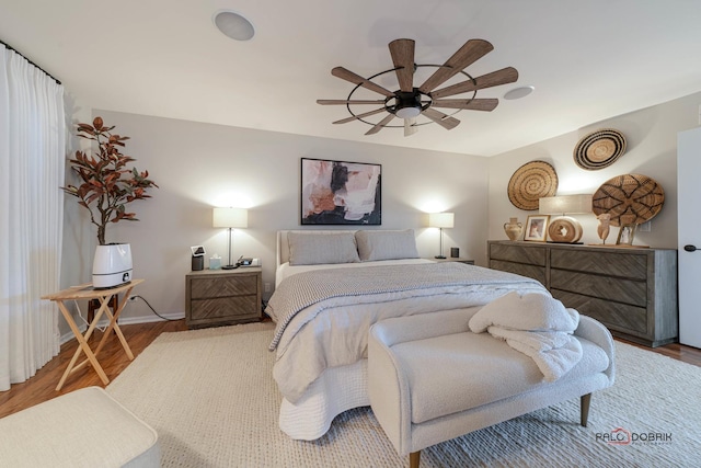 bedroom with hardwood / wood-style flooring and ceiling fan