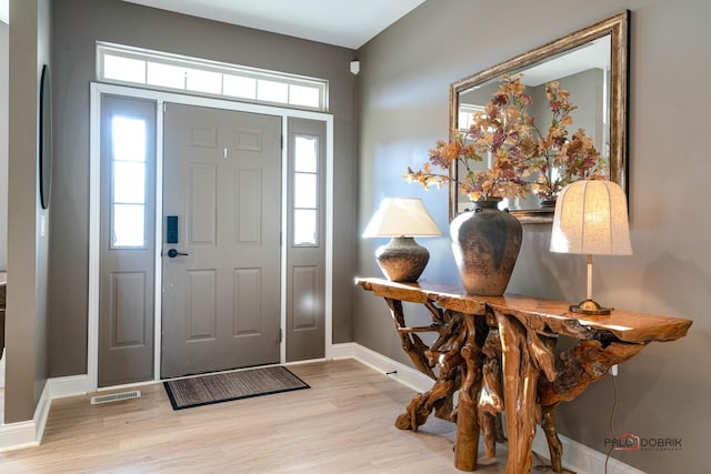 entryway with light hardwood / wood-style flooring