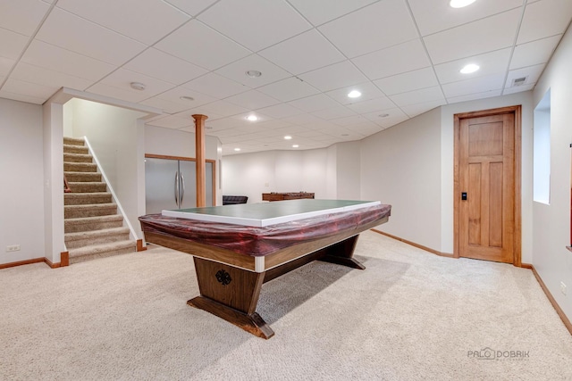 recreation room with a paneled ceiling, light colored carpet, and pool table