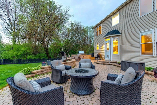 view of patio featuring an outdoor living space with a fire pit