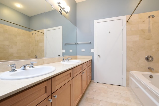 bathroom with vanity, tiled shower / bath combo, and tile patterned floors