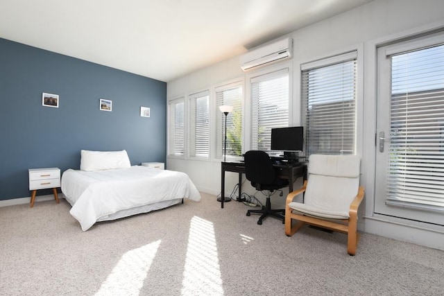 carpeted bedroom with a wall mounted AC