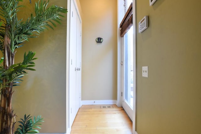 doorway to outside with light hardwood / wood-style floors