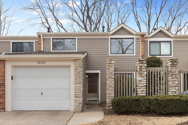 townhome / multi-family property featuring a garage