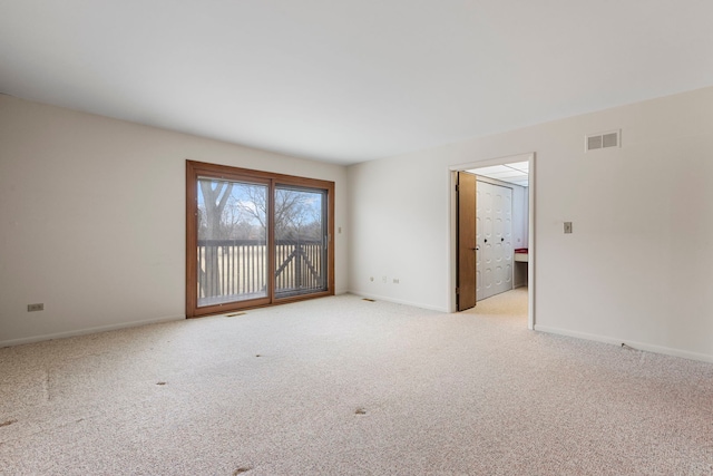 unfurnished room featuring light colored carpet