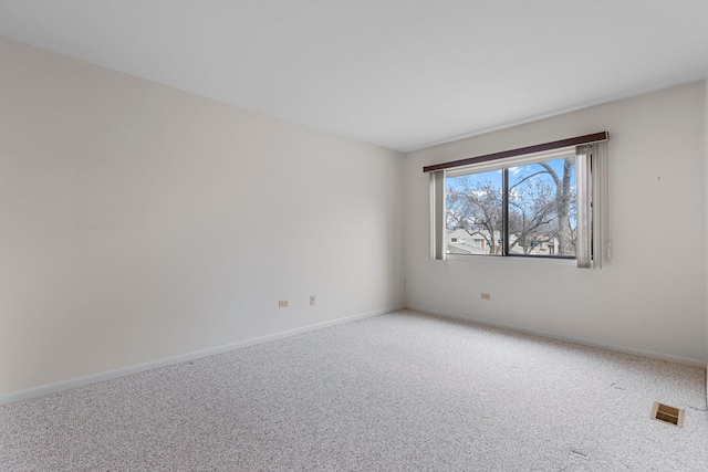 empty room featuring carpet flooring