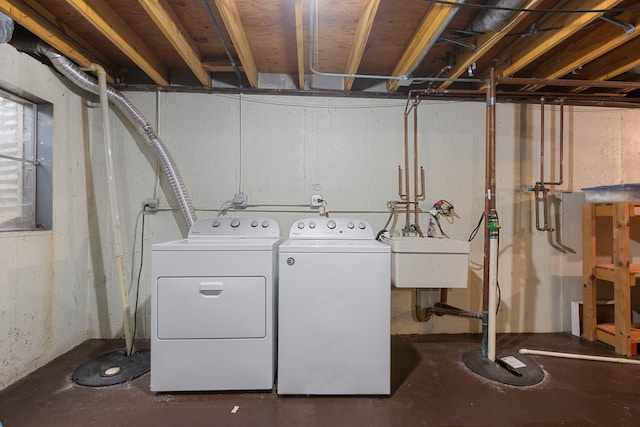 laundry room featuring sink and washer and clothes dryer