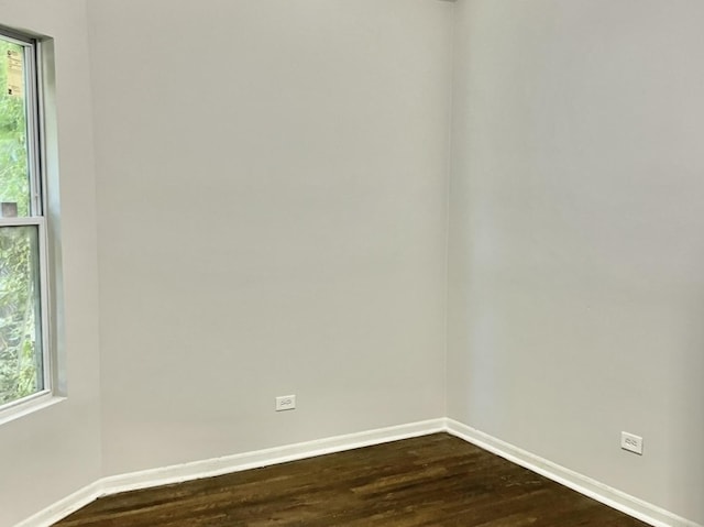 empty room featuring dark hardwood / wood-style floors