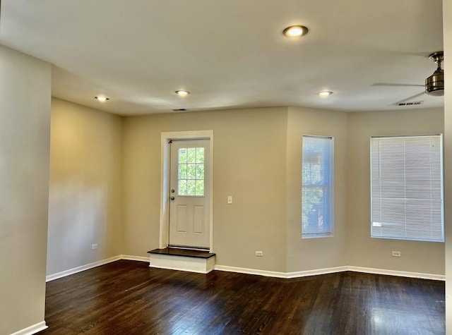 foyer featuring ceiling fan and dark hardwood / wood-style flooring