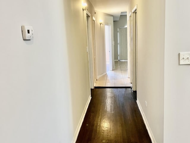 corridor with light hardwood / wood-style flooring