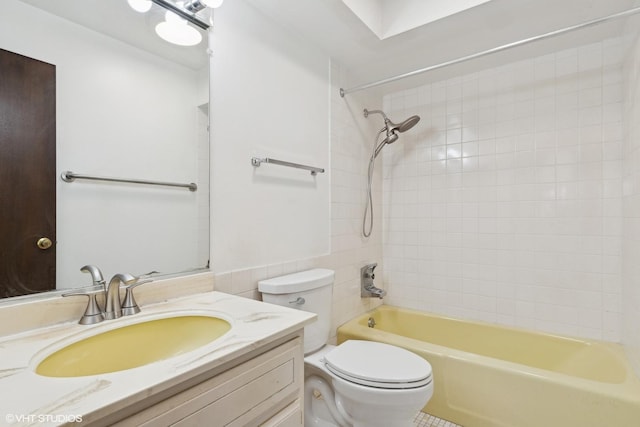 full bathroom with tiled shower / bath combo, vanity, and toilet