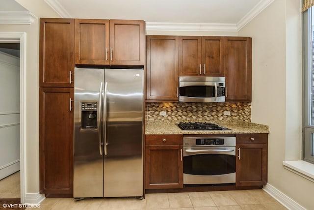 kitchen featuring tasteful backsplash, stainless steel appliances, crown molding, and light stone countertops