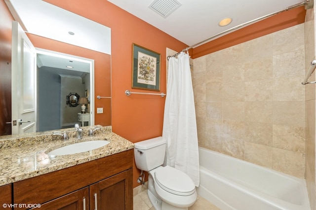 full bathroom with tile patterned flooring, vanity, shower / tub combo, and toilet