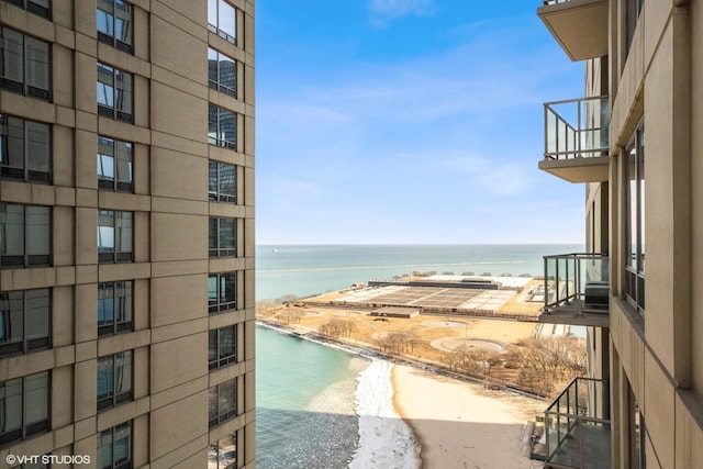 balcony with a view of the beach and a water view