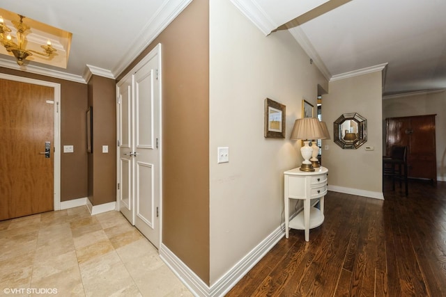 hall with ornamental molding and hardwood / wood-style floors