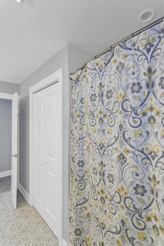 bathroom with a shower with shower curtain