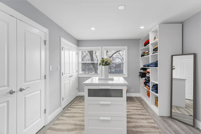 walk in closet featuring light hardwood / wood-style floors